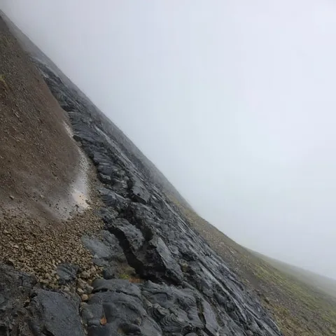 A dark volcanic slope on the Reykjanes peninsula