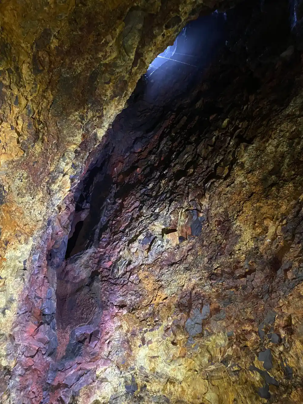 The chamber roof in purple and gold above the rubble slope
