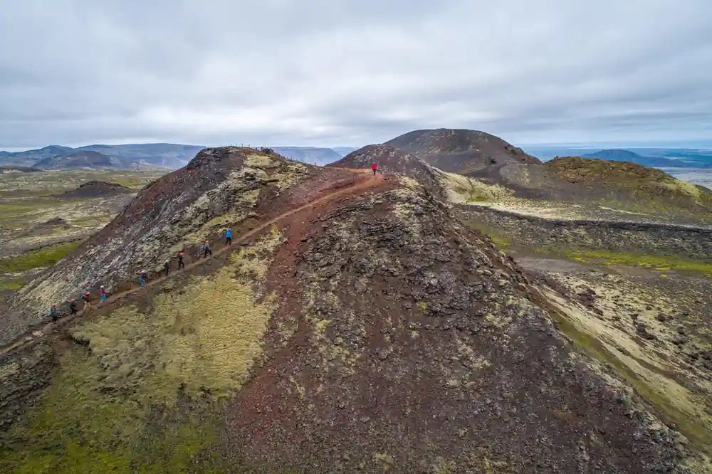 The red scoria cone from the ridge with the path running up it