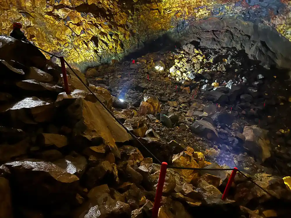 The rubble floor of the chamber lit from above